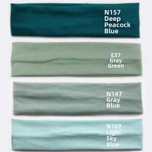 Detailed view of four elastic cotton sweatbands in deep blue, gray-green and light blue