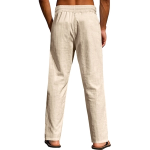 Detail shot of men's cream cotton linen trousers showing natural fabric texture and relaxed fit