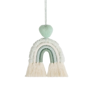 Detail of mint green macrame rainbow car charm with heart bead and cotton tassels