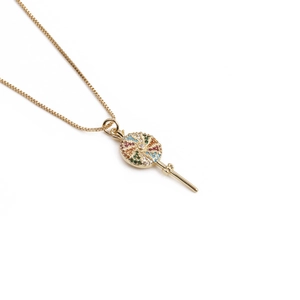 Detailed view of gold lollipop pendant necklace featuring vibrant colorful gemstones