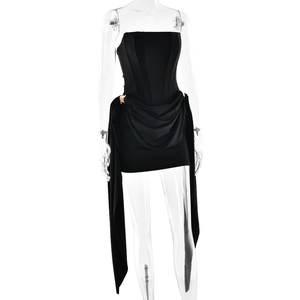 Detail of black strapless mini dress with gold buckle and corseted waist structure