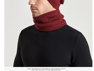 Close-up of burgundy geometric jacquard knit neck gaiter with warm thermal texture