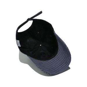 Detailed inner view of blue striped baseball cap showing lining and care label info