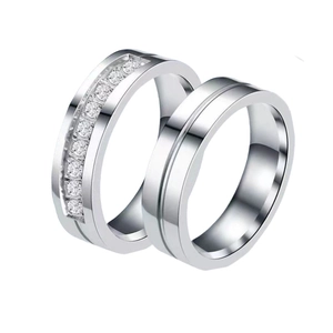 Modern stainless steel couple rings set with channel-set cubic zirconia in silver finish