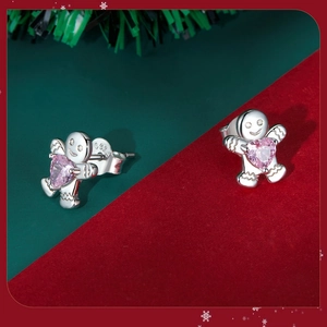 S925 silver gingerbread man earrings with pink heart zircon on festive background