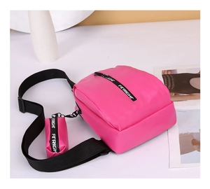 Detail of rose red PU leather chest bag with matching mini coin purse and fashion straps