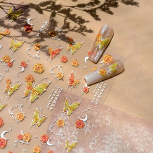 3D embossed nail art stickers with butterfly and rose designs on long nude fake nails