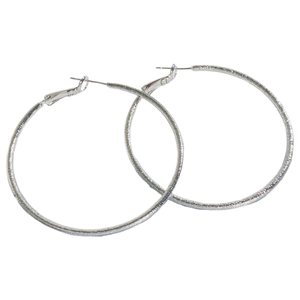 Minimalist large silver round hoop earrings with frosted textured surface on white backdrop