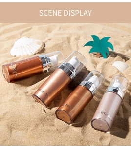 Four bottles of liquid body highlighter displayed on beach sand with sea shells