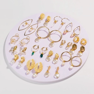 Detailed collection of vintage French style gold earrings with pearls and green stones