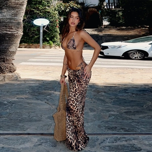 Three-piece leopard print bikini set with matching beach skirt for summer vacation