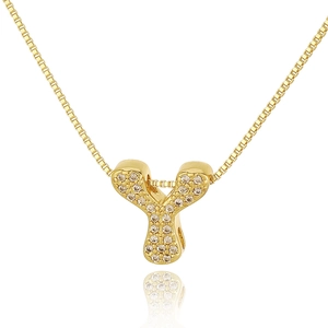 Macro shot of gold-plated letter Y pendant with crystal pavé and box chain detail