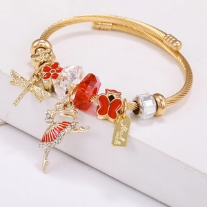 Gold stainless steel charm bracelet with ballet dancer, butterfly, and red crystal beads