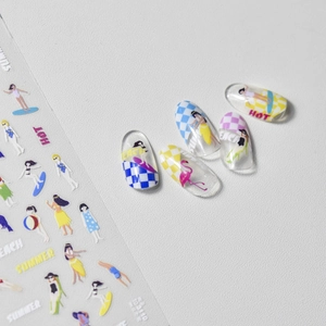 Detail of summer beach nail stickers with flamingos and surfing motifs on clear tips