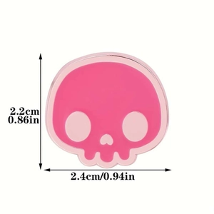 Detailed size view of a pink skull enamel pin showing 2.2cm height and 2.4cm width