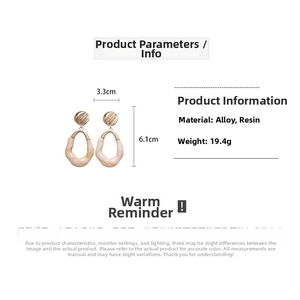Detail view of oval resin earrings with dimensions 3.3cm by 6.1cm and 19.4g weight