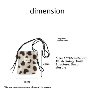 Detail view of plush heart crossbody bag with 16x20cm dimensions and snap closure