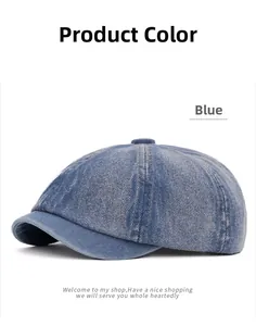 Detailed view of blue washed denim newsboy cap showing stitching and fabric texture