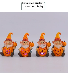 Detail of four Halloween gnomes sitting behind glowing purple LED Jack-o'-lantern pumpkins