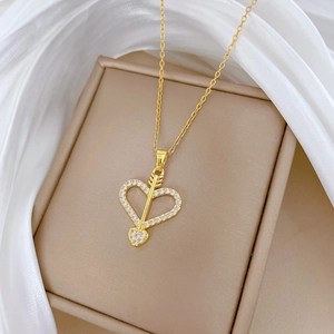 Luxurious gold-plated heart and cupid arrow necklace with shimmering paved crystals