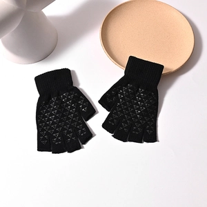 Warm black knitted half-finger gloves with anti-slip palm dots on white background