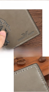 Detail of embossed brand logo and reinforced nylon stitching on gray leather wallet