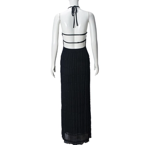 Back view of a black backless halter maxi dress featuring layered pleated fabric on a mannequin