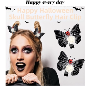 Close-up of Halloween butterfly hair clip with white rose and red skull detail