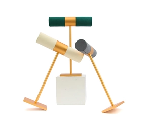 Macro view of T-bar jewelry stands with velvet rolls and golden metal frames