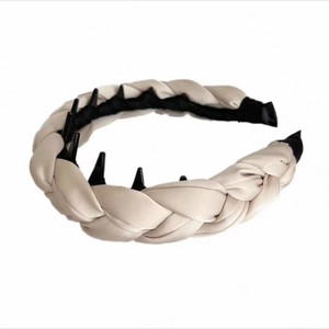 Detail of cream satin braided headband featuring internal black plastic anti-slip teeth