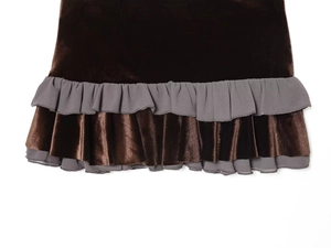 Close-up of brown velvet fabric with grey ruffled hem detail on this stylish mini skirt
