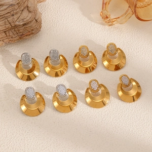 Set of four C-shaped gold hoop earrings with sparkling zircon-encrusted stud details