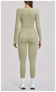 Sage green yoga set showing fitted long sleeve top and high waisted leggings from behind