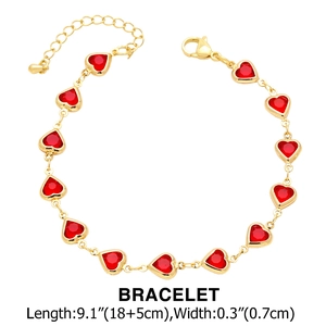 Golden bracelet with red heart-shaped zircons featuring lobster clasp and extension chain