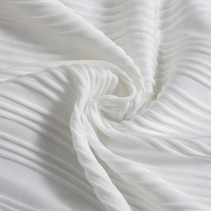 Macro shot of white ribbed knit fabric texture with vertical stripe pattern and soft feel