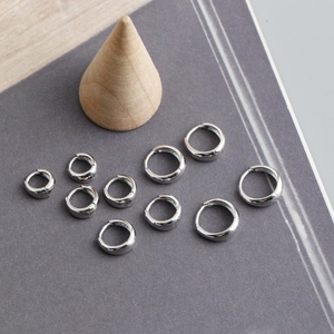 Detailed set of S925 sterling silver hoop earrings in various sizes with polished finish