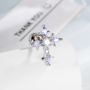 Silver cross stud earring with purple marquise stones and screw back on a white surface