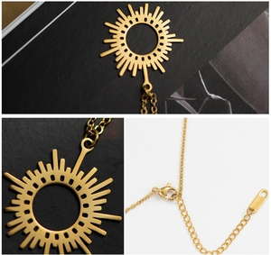 Detail of 18K gold plated stainless steel sunburst pendant with secure lobster clasp