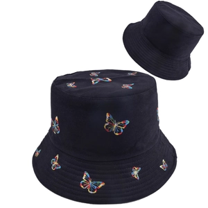 Reversible black cotton bucket hat featuring vibrant butterfly embroidery for sun protection