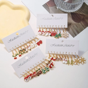 Assorted Christmas earring set with Santa, snowmen, and reindeer designs on cards