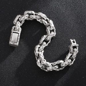 Detail of vintage square link chain bracelet with antique silver hammered texture
