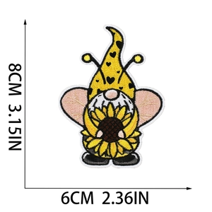 Cute bee gnome embroidery patch with sunflower and polka dot hat measuring 8x6cm