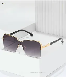 Close-up of square metal sunglasses with gradient purple lenses and gold temples