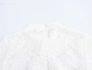 Close-up of elegant white floral lace dress back with seamless invisible zipper detail