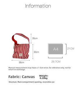 Detailed size comparison of red striped canvas tote bag with A4 paper and features