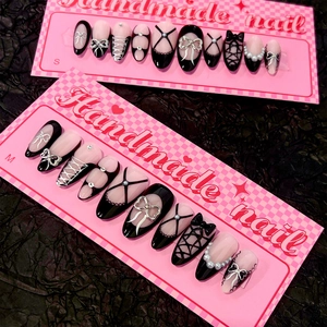 Handmade black and pink short almond press-on nails with 3D bows and pearl accents