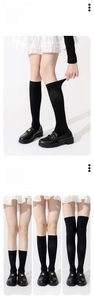 Three lengths of black compression stockings with high elasticity and wide cuffs detail