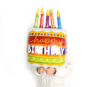Large rainbow birthday cake foil balloon with five candles and Happy Birthday text