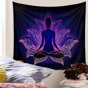 Detailed view of yoga meditation tapestry with lotus hanging over a bedroom headboard