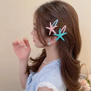Starfish acrylic hair clips in pink and blue colors for beach vacation styles